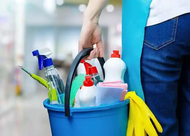 Cleaning detergents and supplies prepared for a spring cleaning service